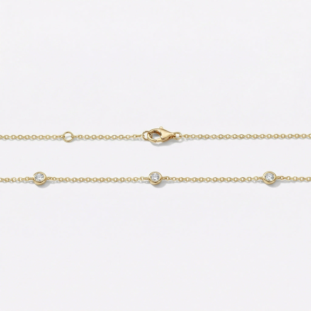 Gold necklace with 3 bezel set diamonds