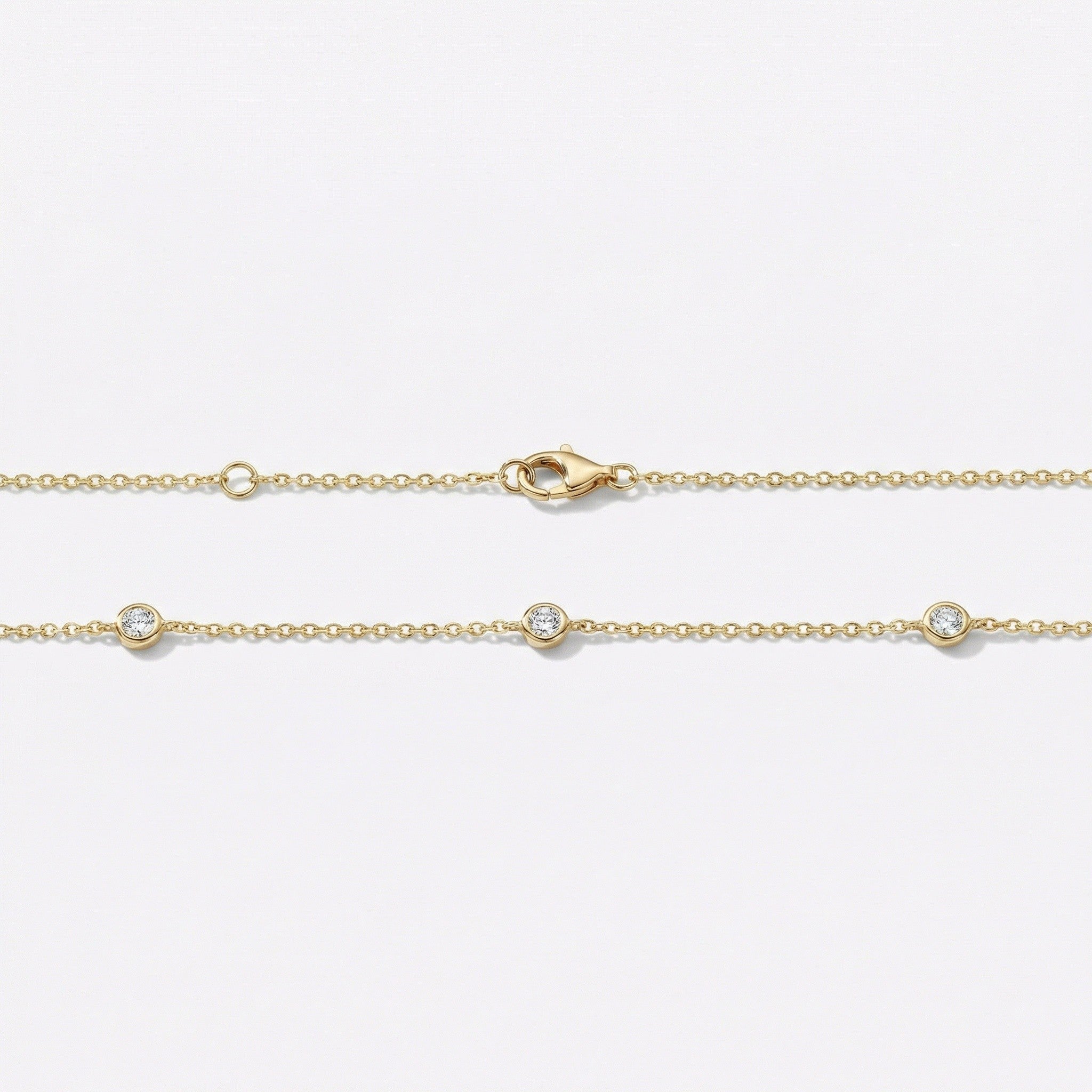 Gold necklace with 3 bezel set diamonds