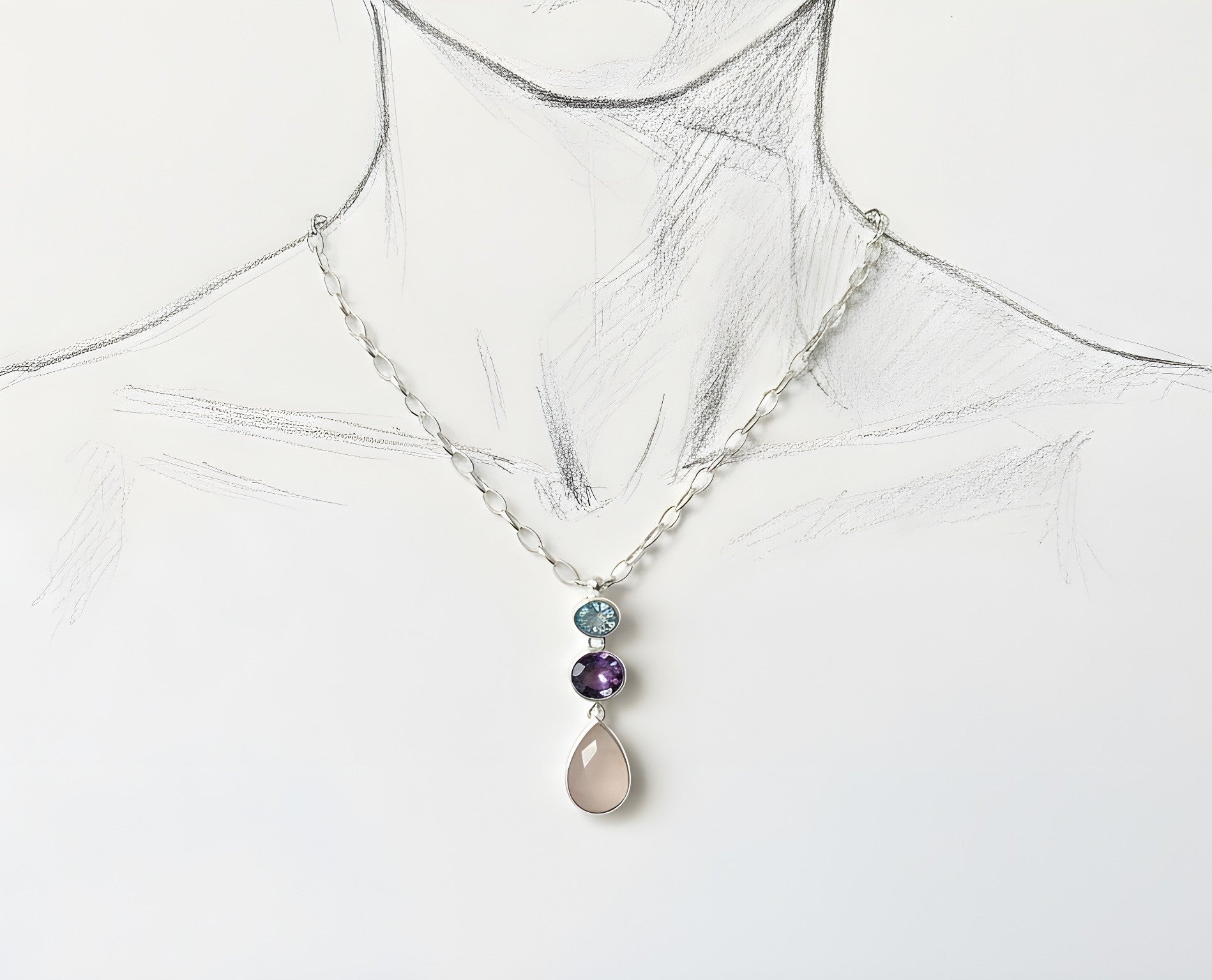 illustration display of 3 stone sterling silver pendant with aquamarine, amethyst and rosa quartz
