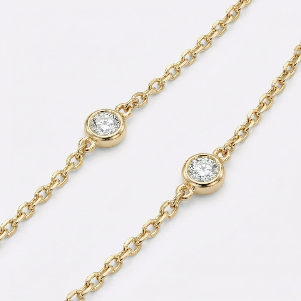 Gold necklace with bezel set diamonds 