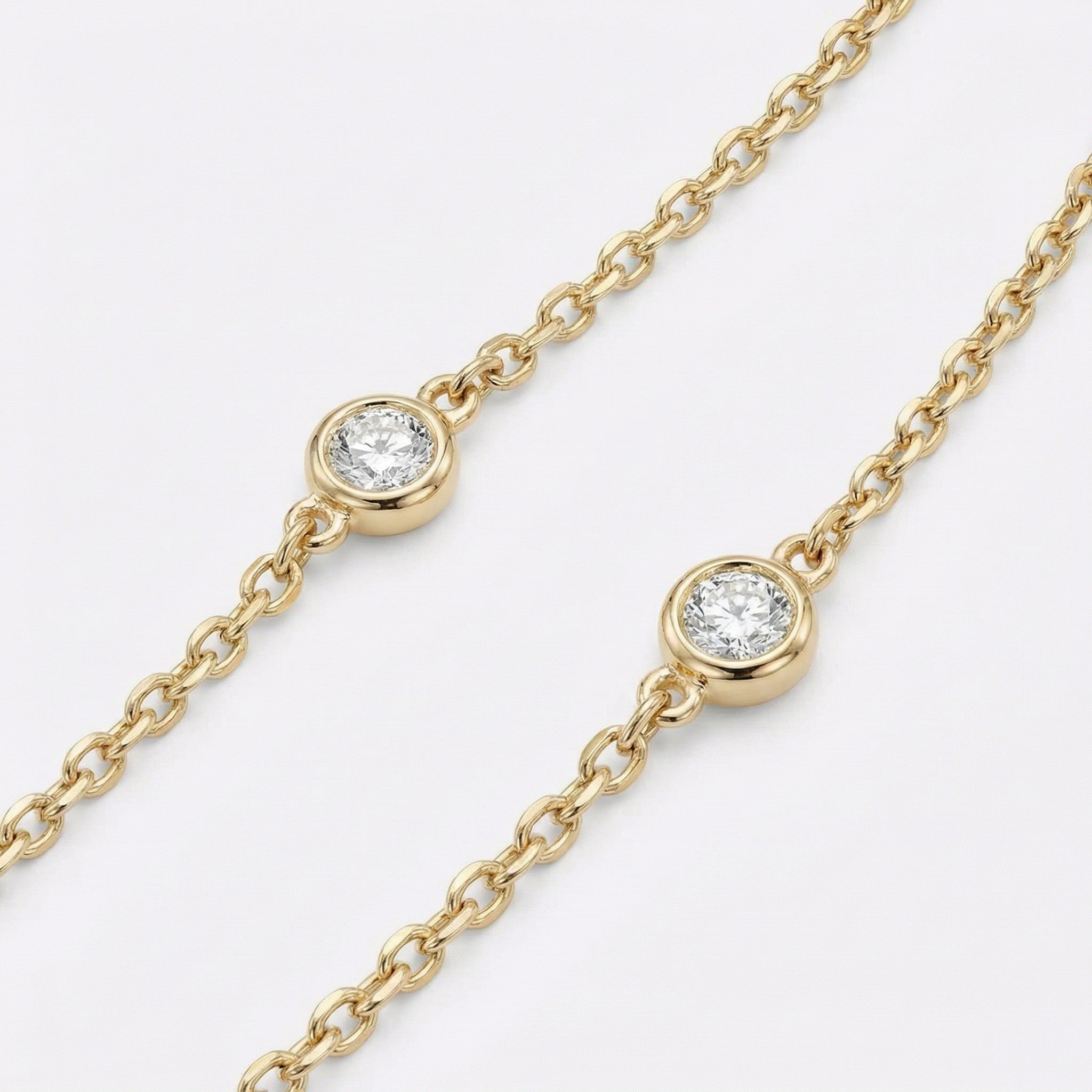 Gold necklace with bezel set diamonds 