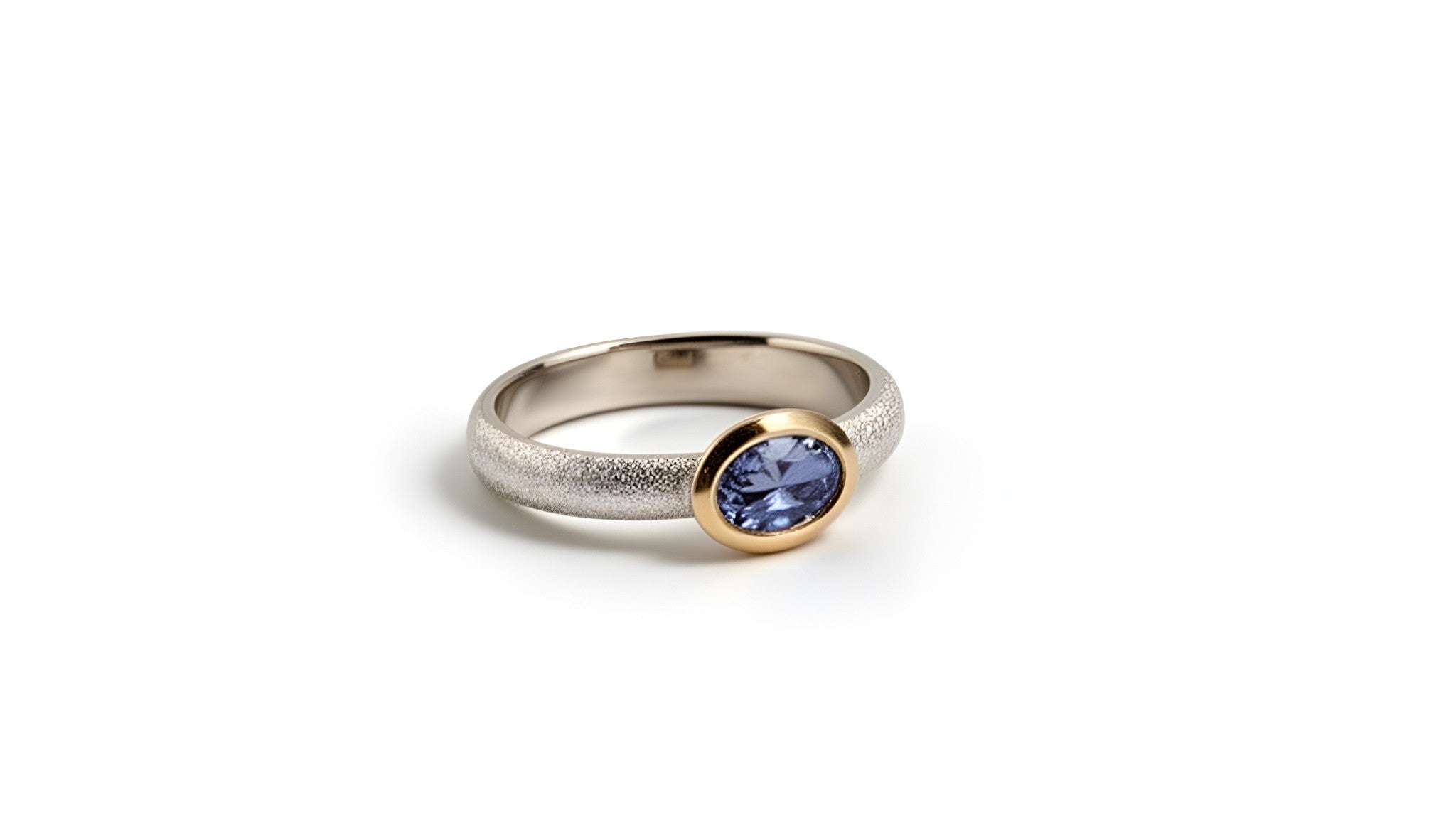 Tanzanite solitaire bezel ring in sterling silver