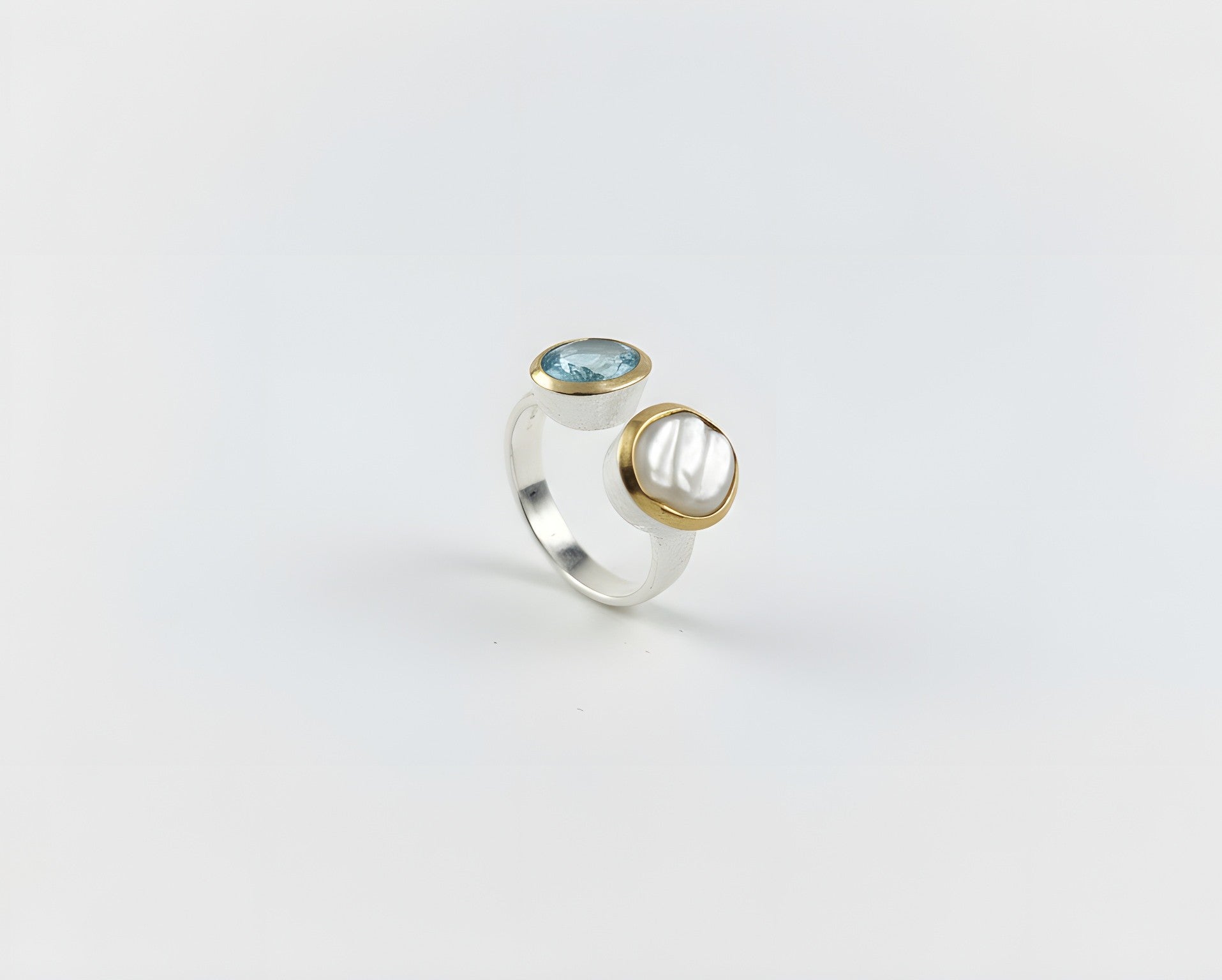 Brushed sterling silver open ring with aquamarine and cultured pearl