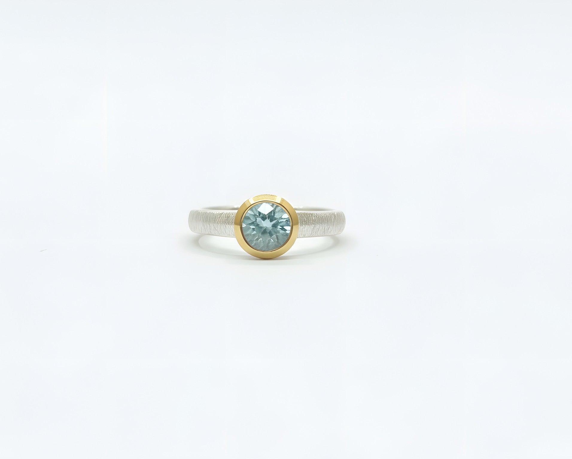 Brushed sterling silver aquamarine solitaire ring in bezel setting
