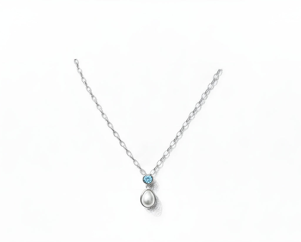 Sterling silver pendant with topaz and cultured pearl