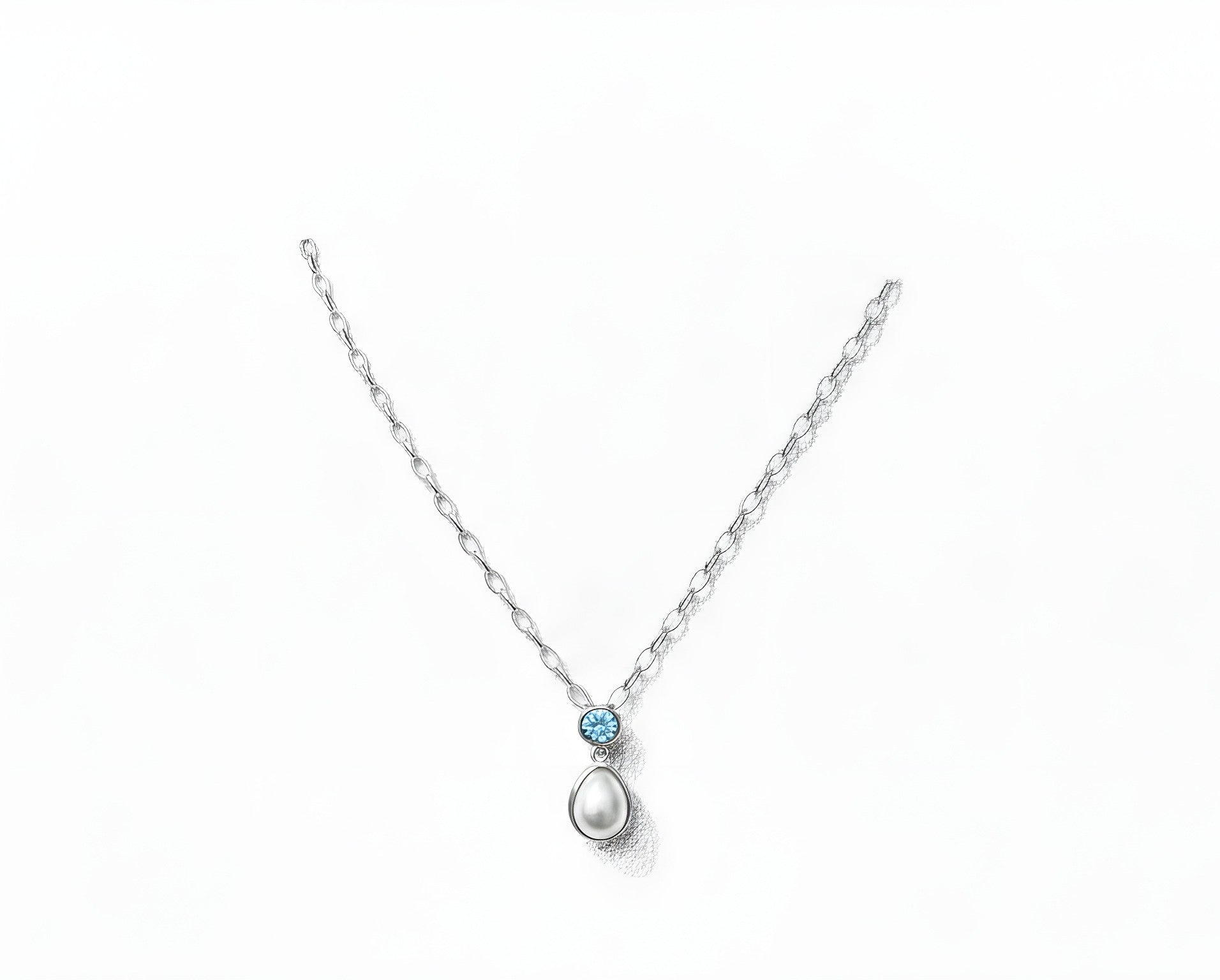 Sterling silver pendant with topaz and cultured pearl